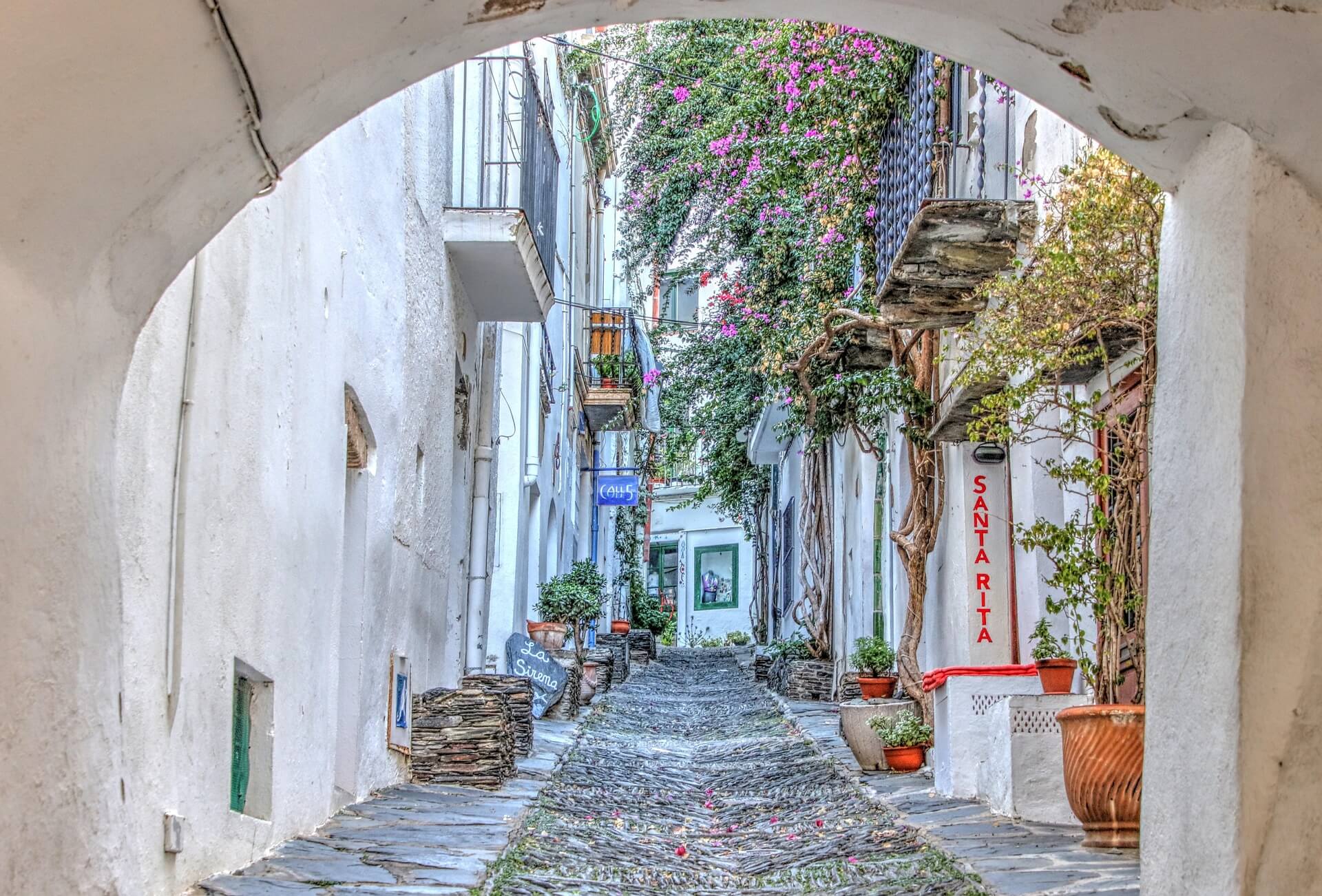 Whitewashed street in a Costa Brava village on signing day